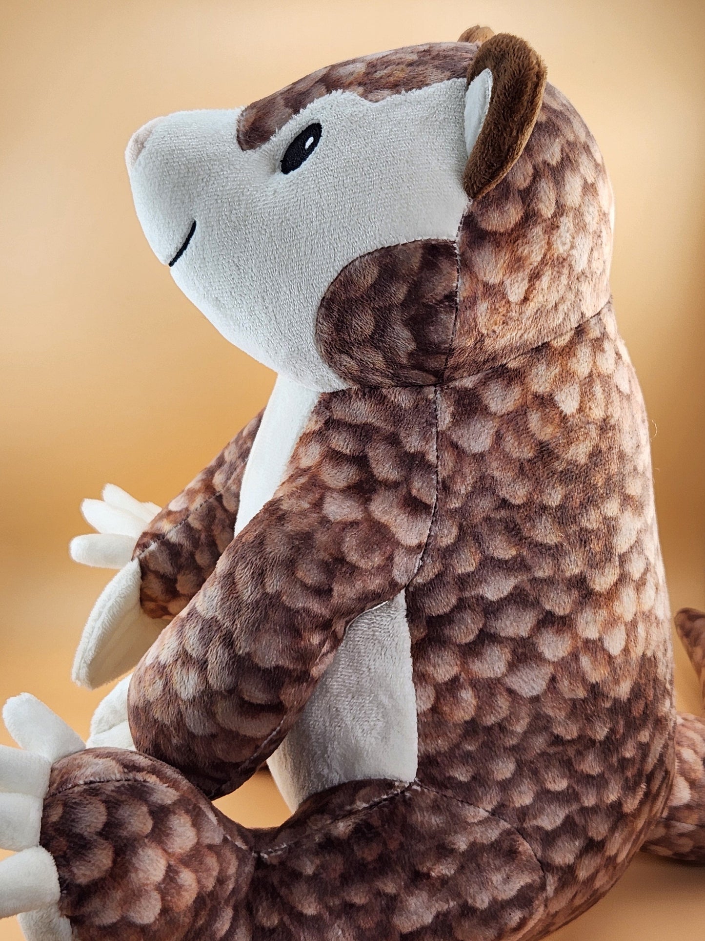 Paulie the Pangolin plush stuffed animal toy side view