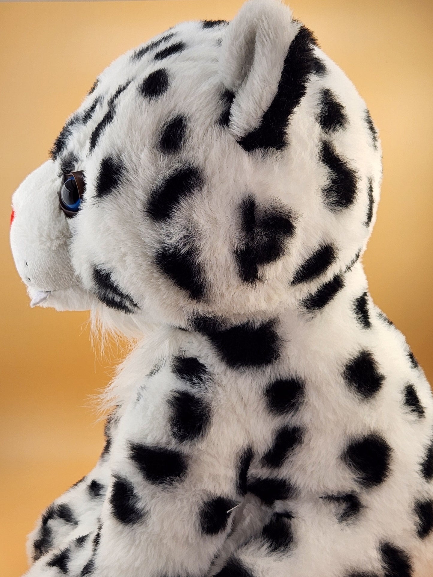 Tashi the Snow Leopard plush stuffed animal toy side view