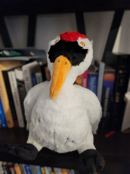 custom whooping crane plush stuffed animal sitting on a shelf