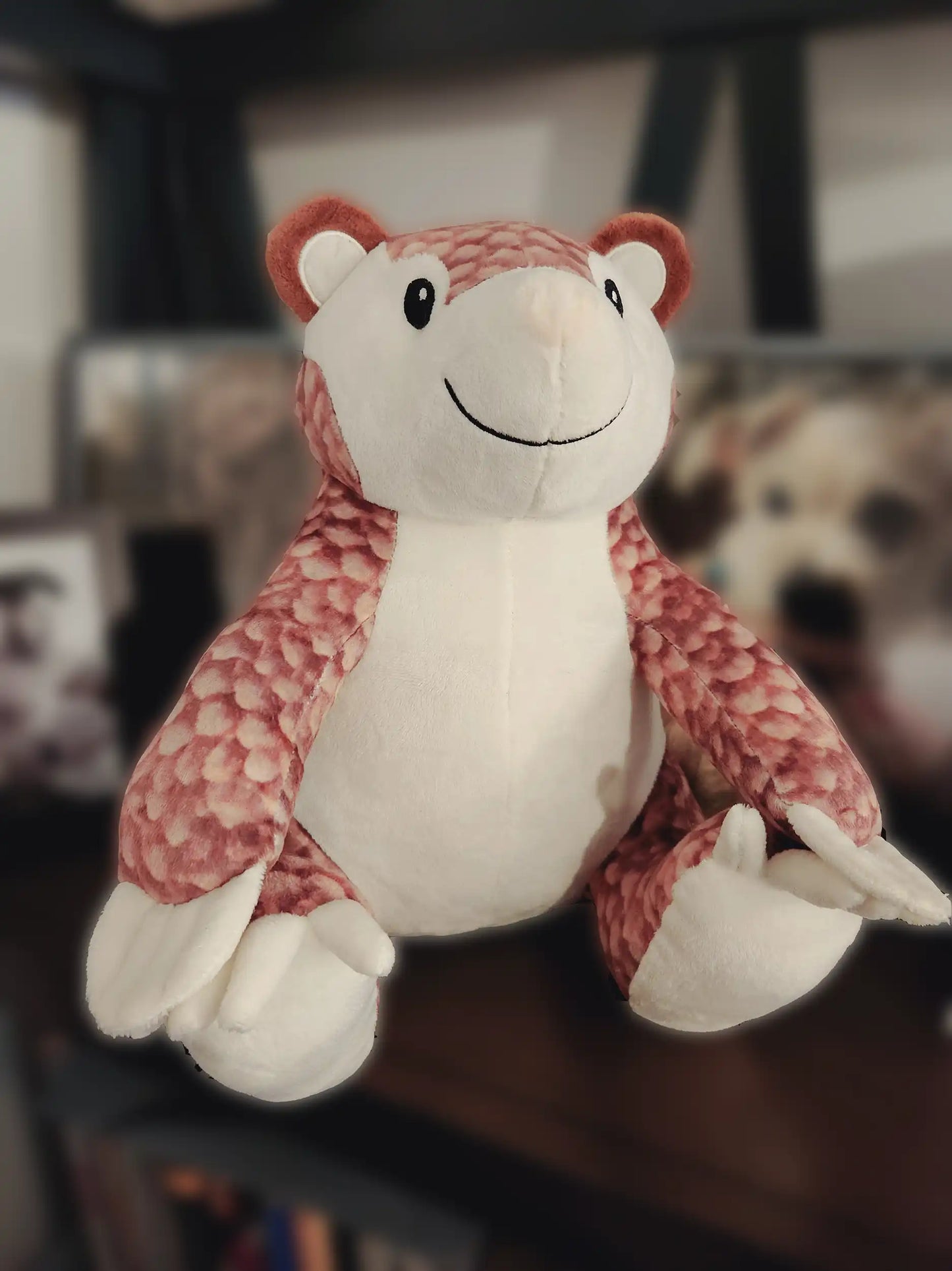 custom pangolin plush stuffed animal sitting on a shelf