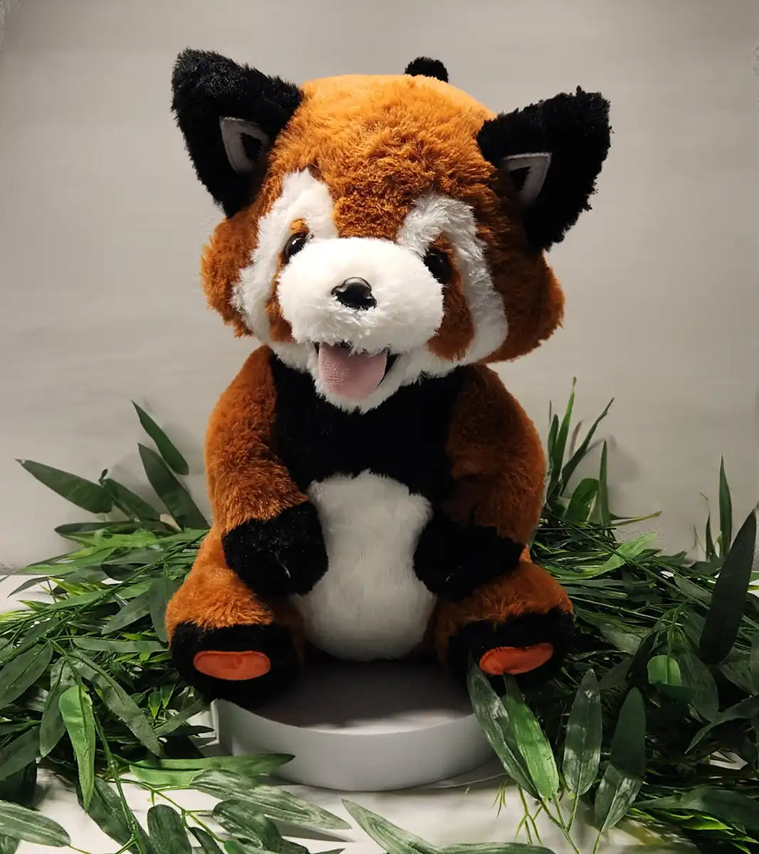 custom red panda plush stuffed animal sitting surrounded by leaves