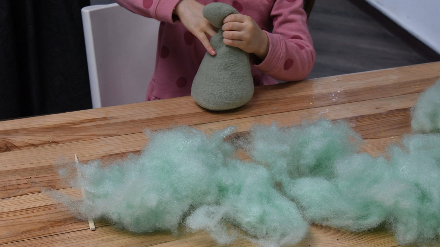 Creator building a stuffed animal with PP cotton